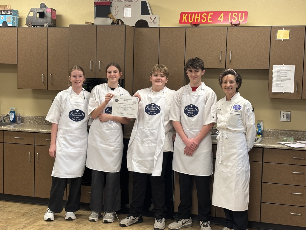 Wow! What an amazing experience for our 7th grade students. Mrs. Schmitt's 7th grade FCS was invited to Waverly-Shell Rock's Middle School Friday, February 13th for an all-day event, along with other schools. Students: Ellie Carlson, Beau Johnson, Dempsey Nelson, and Adam Scott. Mrs. April Schmitt and student teacher, Miss Whitney Tegtmeier accompanied the group too. Kids Feeding Kids is a program that helps with food insecurities. Students made meals that can be frozen and handed out to families. The students made 61 meals. The students learned from a professional chef how to Mise En Place, Knife Skills, time management, how to follow directions, and prep ingredients. The students started with a scavenger hunt on finding the equipment needed to make macaroni and cheese (with Great Northern Beans for protein) topped with Panko bread crumbs, cheese, and parsley. You will see from the pictures how hard the students worked. New Hampton Middle School was awarded "Most Organized" out of the six schools that attended. A huge "thank you" to Kristie Kuhse and Waverly Shell-Rock for this opportunity.