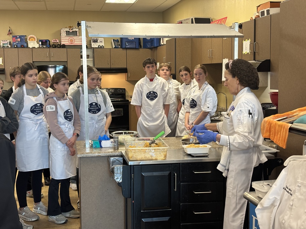 Wow! What an amazing experience for our 7th grade students. Mrs. Schmitt's 7th grade FCS was invited to Waverly-Shell Rock's Middle School Friday, February 13th for an all-day event, along with other schools. Students: Ellie Carlson, Beau Johnson, Dempsey Nelson, and Adam Scott. Mrs. April Schmitt and student teacher, Miss Whitney Tegtmeier accompanied the group too. Kids Feeding Kids is a program that helps with food insecurities. Students made meals that can be frozen and handed out to families. The students made 61 meals. The students learned from a professional chef how to Mise En Place, Knife Skills, time management, how to follow directions, and prep ingredients. The students started with a scavenger hunt on finding the equipment needed to make macaroni and cheese (with Great Northern Beans for protein) topped with Panko bread crumbs, cheese, and parsley. You will see from the pictures how hard the students worked. New Hampton Middle School was awarded "Most Organized" out of the six schools that attended. A huge "thank you" to Kristie Kuhse and Waverly Shell-Rock for this opportunity.