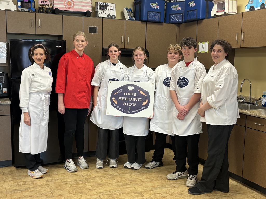 Wow! What an amazing experience for our 7th grade students. Mrs. Schmitt's 7th grade FCS was invited to Waverly-Shell Rock's Middle School Friday, February 13th for an all-day event, along with other schools. Students: Ellie Carlson, Beau Johnson, Dempsey Nelson, and Adam Scott. Mrs. April Schmitt and student teacher, Miss Whitney Tegtmeier accompanied the group too. Kids Feeding Kids is a program that helps with food insecurities. Students made meals that can be frozen and handed out to families. The students made 61 meals. The students learned from a professional chef how to Mise En Place, Knife Skills, time management, how to follow directions, and prep ingredients. The students started with a scavenger hunt on finding the equipment needed to make macaroni and cheese (with Great Northern Beans for protein) topped with Panko bread crumbs, cheese, and parsley. You will see from the pictures how hard the students worked. New Hampton Middle School was awarded "Most Organized" out of the six schools that attended. A huge "thank you" to Kristie Kuhse and Waverly Shell-Rock for this opportunity.