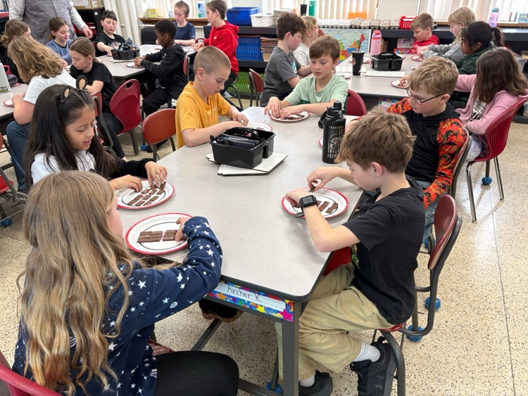 Today fourth graders listened to Mr. Pagel and Ms. Schwickerath read the Hershey's Fraction book in math class