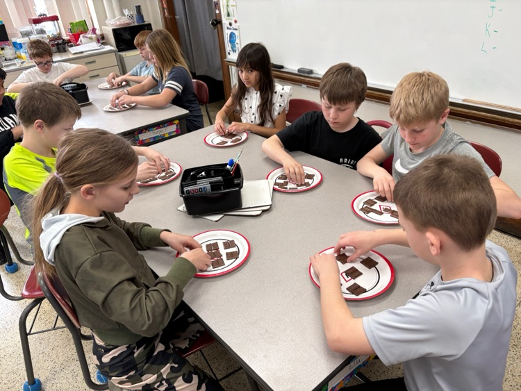 Today fourth graders listened to Mr. Pagel and Ms. Schwickerath read the Hershey's Fraction book in math class