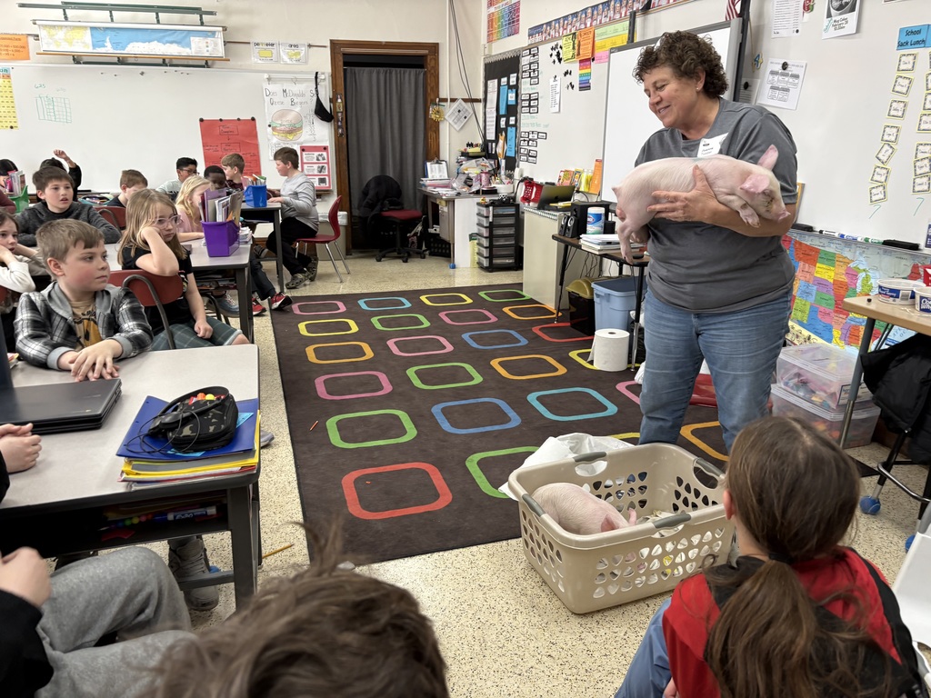 The fourth-grade classes were visited by Joanne Tupper, our Ag. Partner in Education. She provided information about their pork operation and described how math is used on a daily basis. They learned about the different types of meat that we can get from pigs. She also brought two piglets for the students to pet.