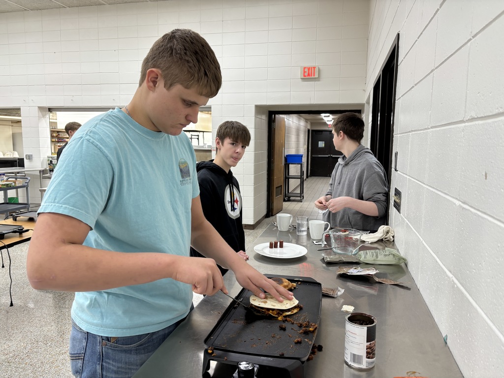 Foods II (two sections) had a guest speaker (Tristan Vanatta) from the National Guard. Vanatta did an MRE (meals ready to eat) challenge with both sections. The student could add ingredients and spices to their dish. Plating and taste were judge and the winners were freshmen: Camden Bruess, Ben Carlton, Cade Orr, and Kingsley Paulsen. Mrs. Schmitt did not get a picture of the winning meal, but of a few of the runner-ups.