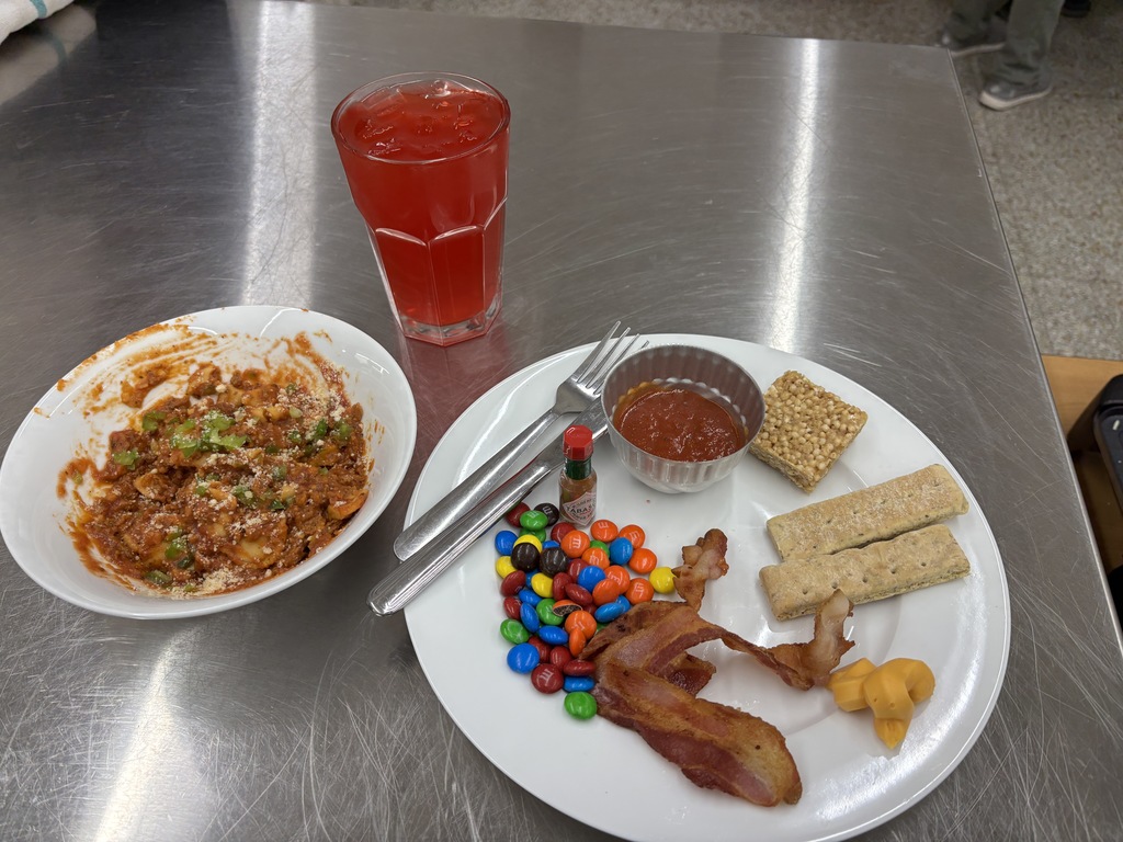 Foods II (two sections) had a guest speaker (Tristan Vanatta) from the National Guard. Vanatta did an MRE (meals ready to eat) challenge with both sections. The student could add ingredients and spices to their dish. Plating and taste were judge and the winners were freshmen: Camden Bruess, Ben Carlton, Cade Orr, and Kingsley Paulsen. Mrs. Schmitt did not get a picture of the winning meal, but of a few of the runner-ups.