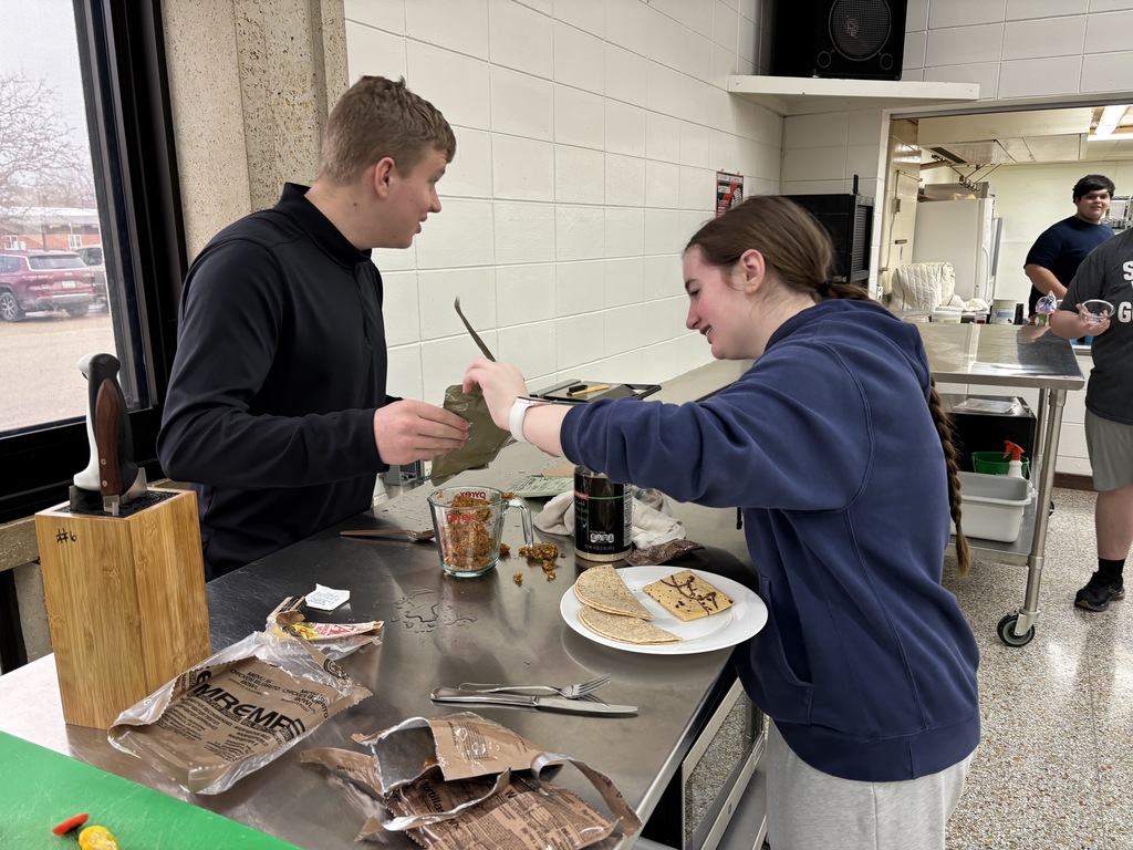 Foods II (two sections) had a guest speaker (Tristan Vanatta) from the National Guard. Vanatta did an MRE (meals ready to eat) challenge with both sections. The student could add ingredients and spices to their dish. Plating and taste were judge and the winners were freshmen: Camden Bruess, Ben Carlton, Cade Orr, and Kingsley Paulsen. Mrs. Schmitt did not get a picture of the winning meal, but of a few of the runner-ups.