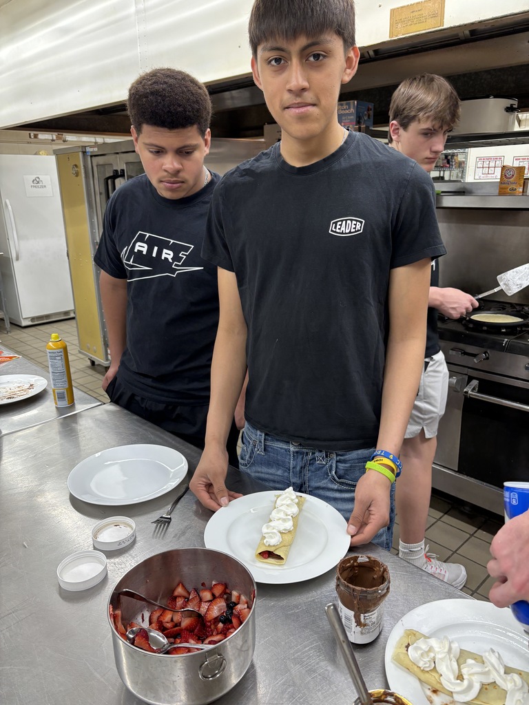 Here are some of the pictures of the students making crêpes. Crêpes are pronounced "krep," rhyming with "step." English people commonly mispronounce it. Thank you, Mrs. Glenn for telling Mrs. Schmitt's students this. They topped it off with fresh fruit, Nutella, and whipped cream. Ooh, la, la! 
