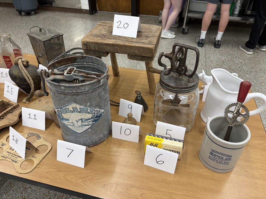 Mrs. Schmitt has two sections of Foods II classes that are currently on their extensive dairy unit. They have learned about the nutrition of dairy, the variety, and how to carefully cook milk and cheese without scorching it. The labs for this unit were making vanilla and chocolate cooked pudding, old-fashioned ice cream, easy ice cream, and butter. The students also did a milk taste-testing lab and filled out a reflection sheet. Unfortunately, Mrs. Schmitt was busy helping, so few pictures were taken of all of their work. Mrs. Schmitt brought many of her dairy antiques (Schmitts were dairy farmers for years) for the students to participate in an activity of guessing gadgets from the past. A dairy carnival for New Hampton kindergarten students is in the planning process by the high school students. 