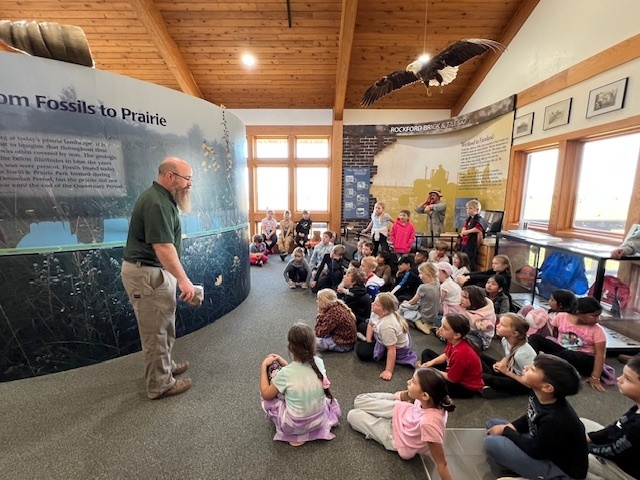 Second grade had a wonderful time at the Rockford Fossil Park. It was a beautiful day to explore the nature center, take a hike on native prairie land, and hunt for fossils! Thanks to Matt Crayne and our parent chaperones for helping us out. The elementary raffle fund helped pay for this field trip.