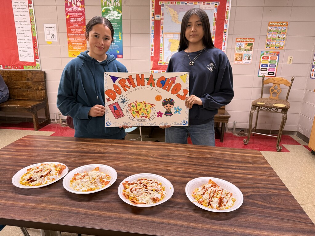 Spanish II students designed their own taco stand and poster and brought their recipes to life in their cooking project. They prepared dishes like Dorinachos, beef tacos, chicken quesadillas, and many other delicious creations. A fun way to learn language and culture through food! 🌮