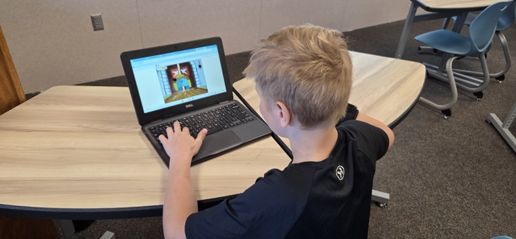 Students in the Intro to Computer Science - Game Design endmester class are learning how to use the coding platform Scratch to create their own video games.