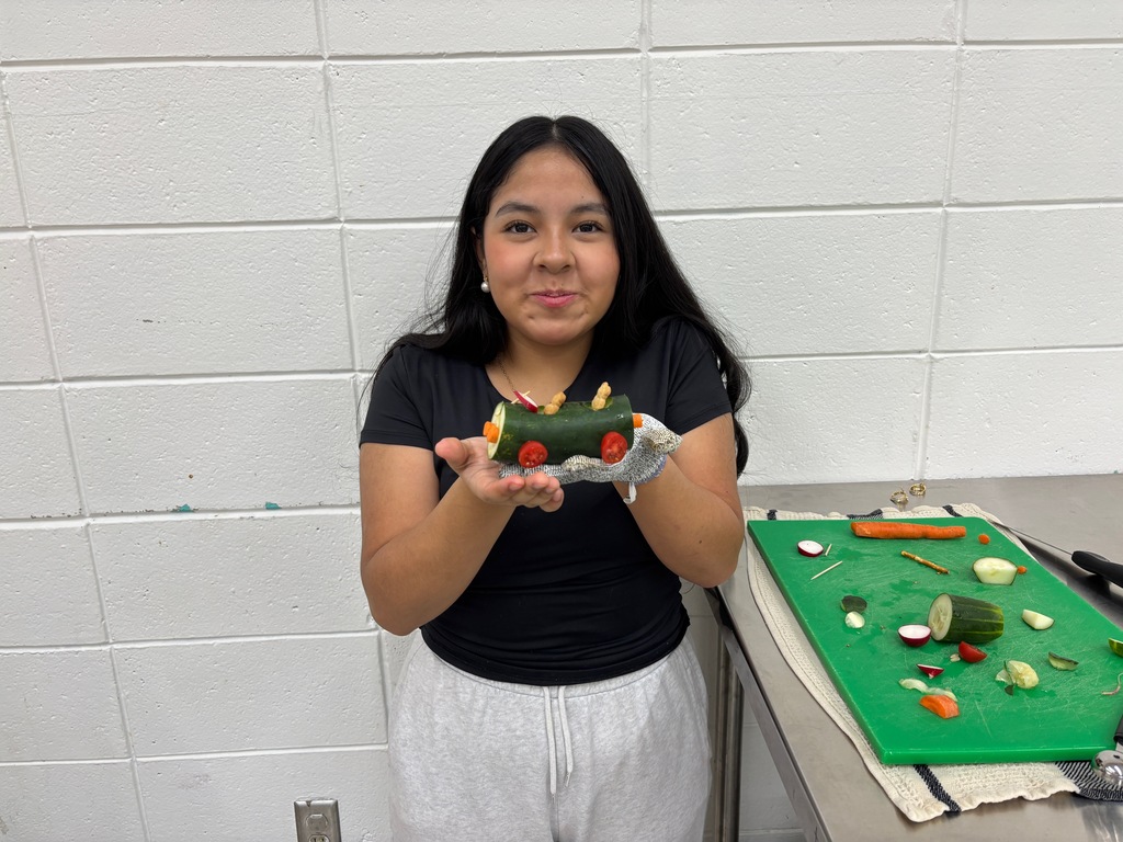 7th grade FCS (Family & Consumer Science) students honed their knife skills by making Veggie Cars. All 40 students (in two sections) safely made a vehicle. You can see by their smiles how proud they were of their success.