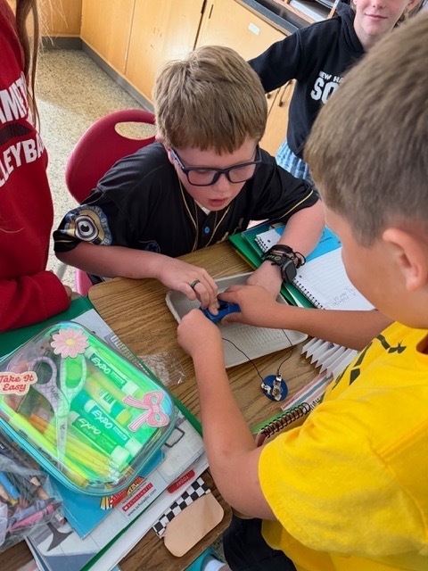 4th graders got the chance to bring working with circuits. Students have been learning about the different types of energy. Yesterday, they had the chance to start working with circuits. They had to make a closed circuit with 1 battery, 2 wires, and a light bulb!
