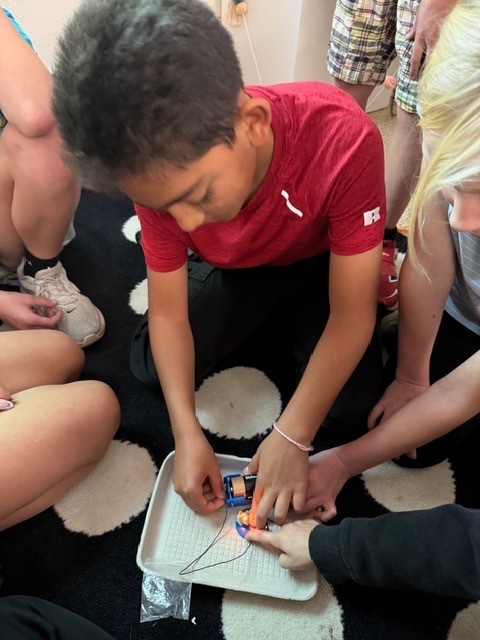 4th graders got the chance to bring working with circuits. Students have been learning about the different types of energy. Yesterday, they had the chance to start working with circuits. They had to make a closed circuit with 1 battery, 2 wires, and a light bulb!