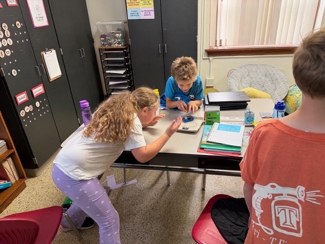 4th graders got the chance to bring working with circuits. Students have been learning about the different types of energy. Yesterday, they had the chance to start working with circuits. They had to make a closed circuit with 1 battery, 2 wires, and a light bulb!