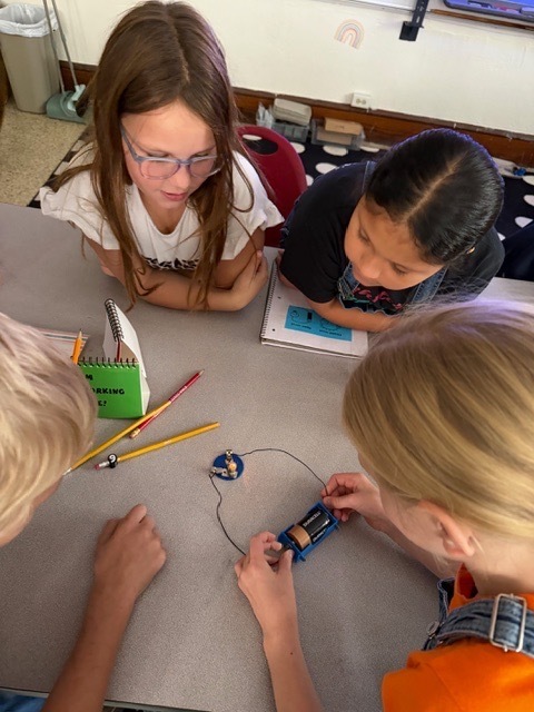 4th graders got the chance to bring working with circuits. Students have been learning about the different types of energy. Yesterday, they had the chance to start working with circuits. They had to make a closed circuit with 1 battery, 2 wires, and a light bulb!