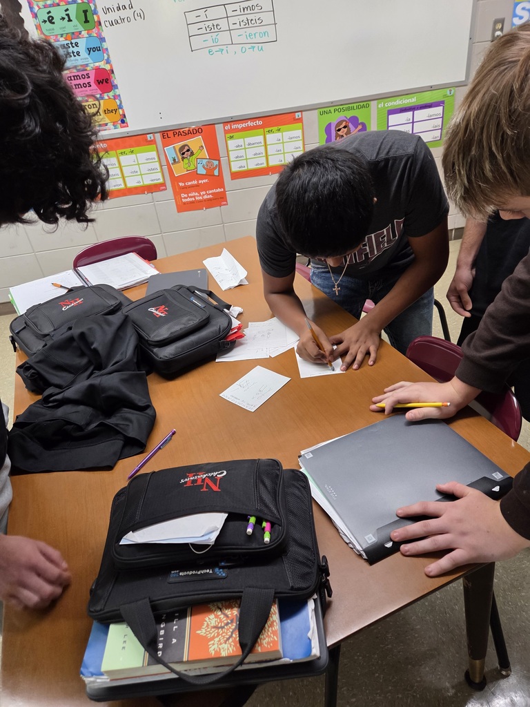 Students in Mrs. Macon's Spanish I classes did an activity called "Running Dictation." Parts of the class story from the previous day are placed around the room. Students are put into teams of 4 with different roles assigned: Runner, Scribe, Illustrator, and Cheerleader. The runner visits each "station" and returns to their group to report the information in Spanish. The Scribe writes in Spanish what the Runner said. The paper is passed to the Illustrator who has to read the Spanish and draw a picture of it. And the cheerleader encourages and helps the team. The roles rotate so that all students are using the skills of speaking, listening, writing, and reading.