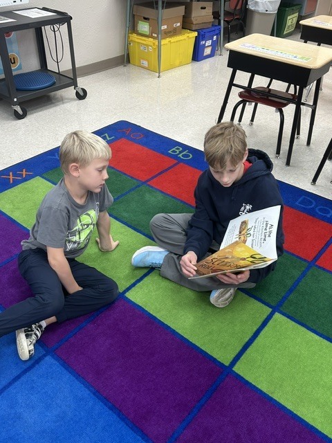 The 4th graders had a special opportunity during intervention to visit Mrs. Ollendieck’s 1st-grade class and share their reading skills! 📖✨  The 4th-grade readers have been working hard on reading with expression, fluency, and confidence, and reading to our first graders was a fun way to put those skills into practice! It was wonderful to see our older students sharing their love of reading with our younger learners. 🥰  Building strong readers and a love of books, one story at a time! 💙📚  #ReadersAreLeaders #ReadingWithExpression #LiteracyInAction