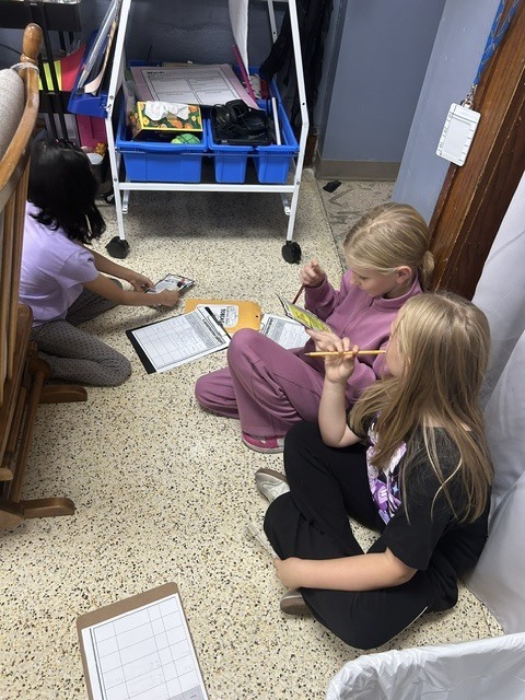 The 4th graders have been putting their inference skills to the test in literacy! Students read clues, used their background knowledge, and made inferences to figure out where a person lives and what costume they are wearing for Halloween. 🏡🦇   They had to look beyond what the clues said and use their detective skills to figure out what they could infer! 🔎🧠   The students are learning that good readers don’t just read the words—they think about the clues and put the pieces together! 📚✨   #FourthGradeLiteracy #MakingInferences #ReadingDetectives #LearningIsFun