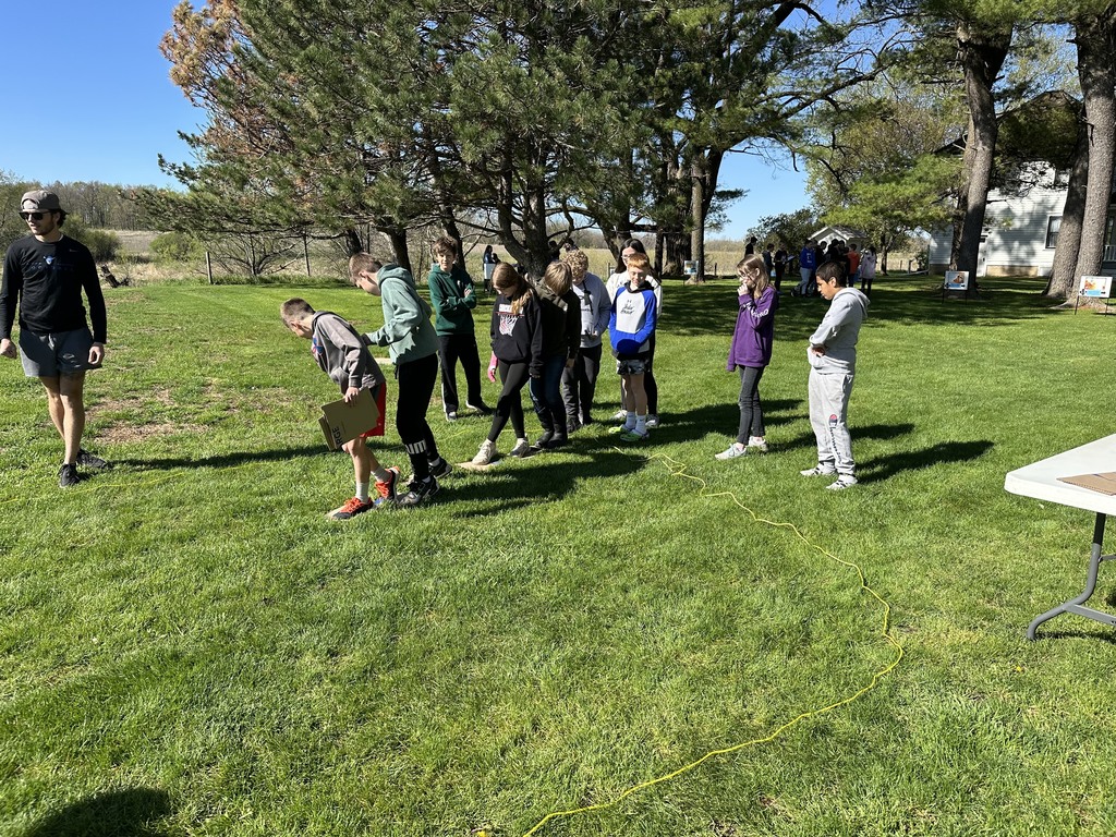 5th graders enjoying the beautiful day at the Norman Bourlag farm. 