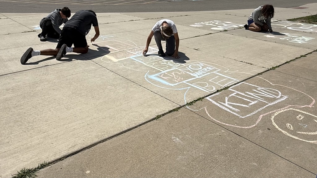 Students being creative with chalk.