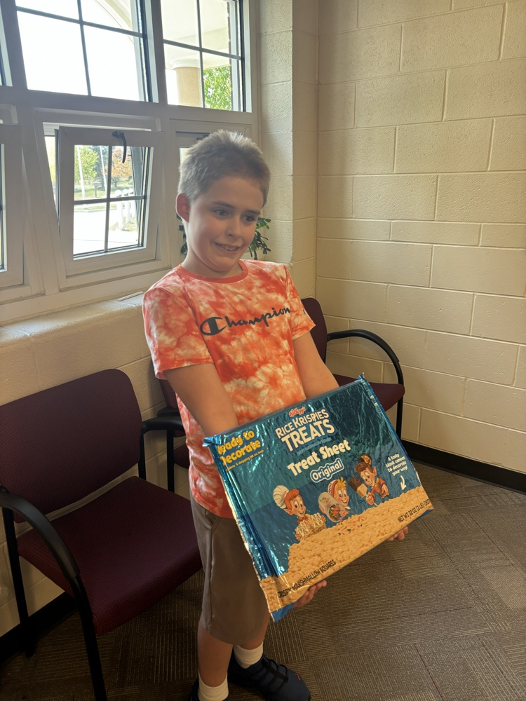 student holding rice Krispy