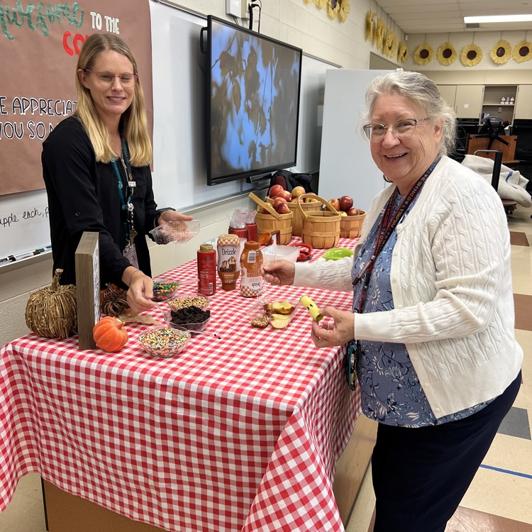 staff cutting Apples
