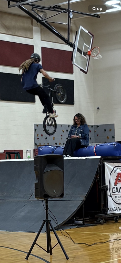 bike jumping over a teacher