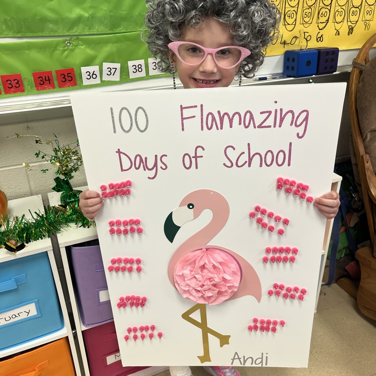 students holding a sign