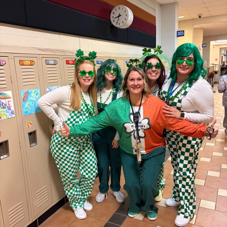 staff dressed in green