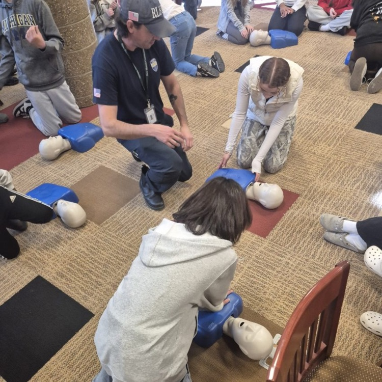 students practicing cpr