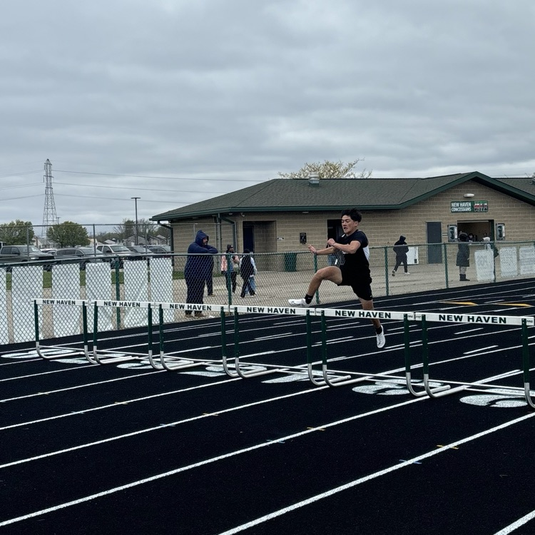 students jumping hurdles 