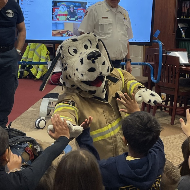 students with a fire dog