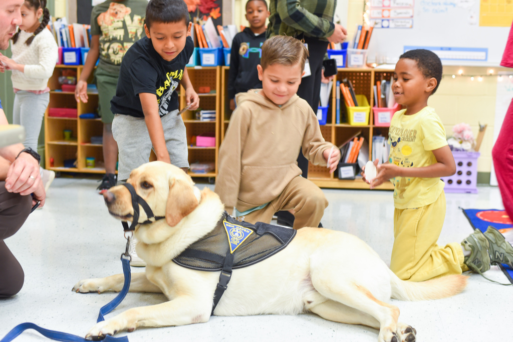 students petting officer sunny
