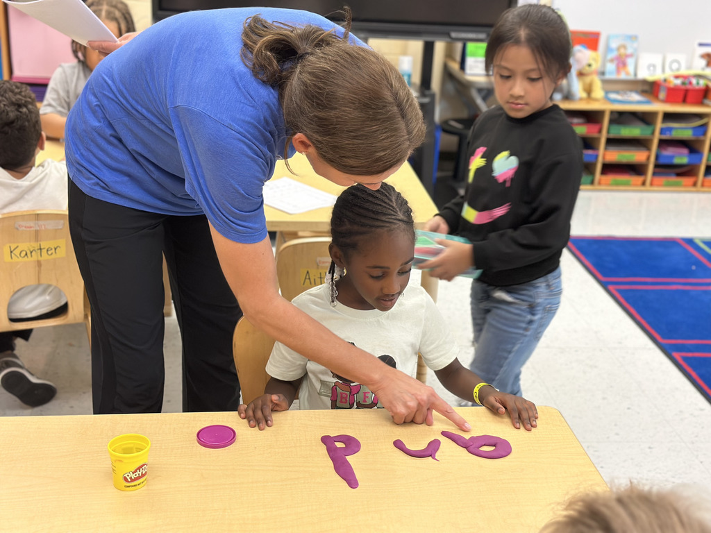 reading the letters and word to the teacher