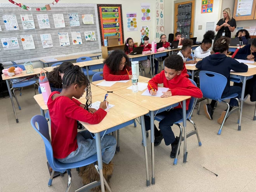 Students working on activities related to six and seven for the 67th Day of School