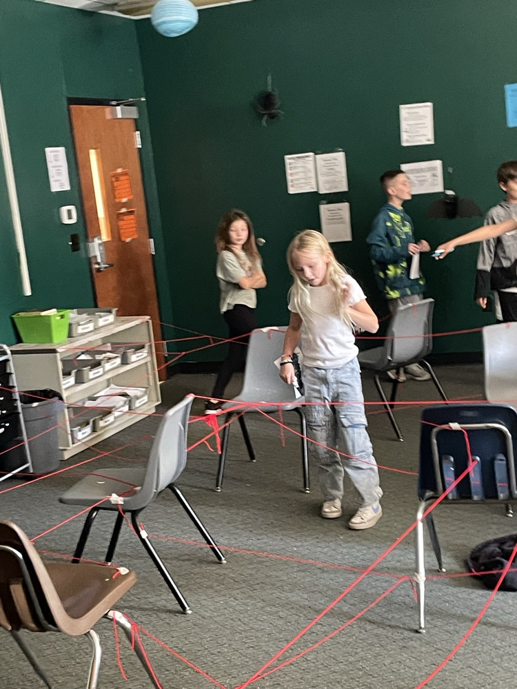 students go through fake laser grid