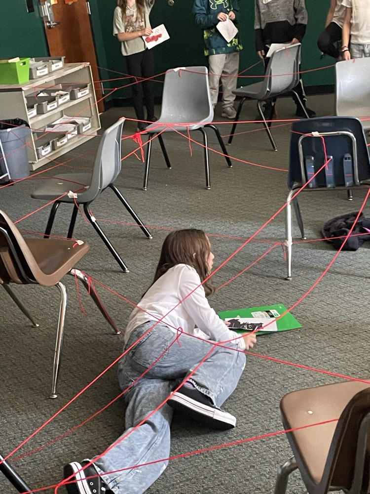 kid goes through fake laser grid