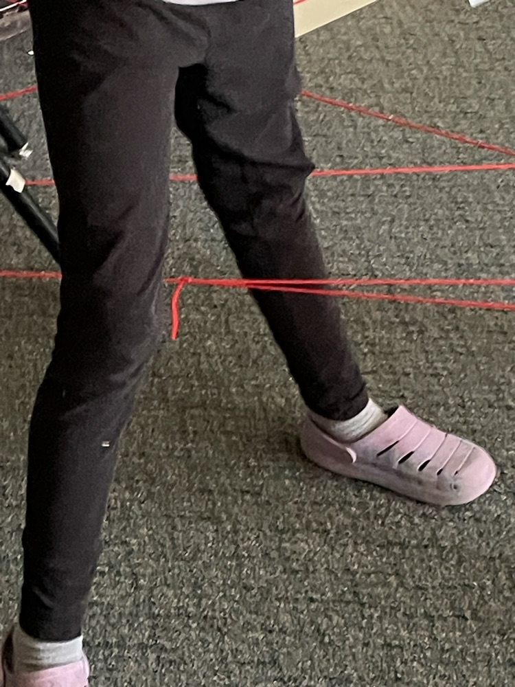 kid goes through fake laser grid