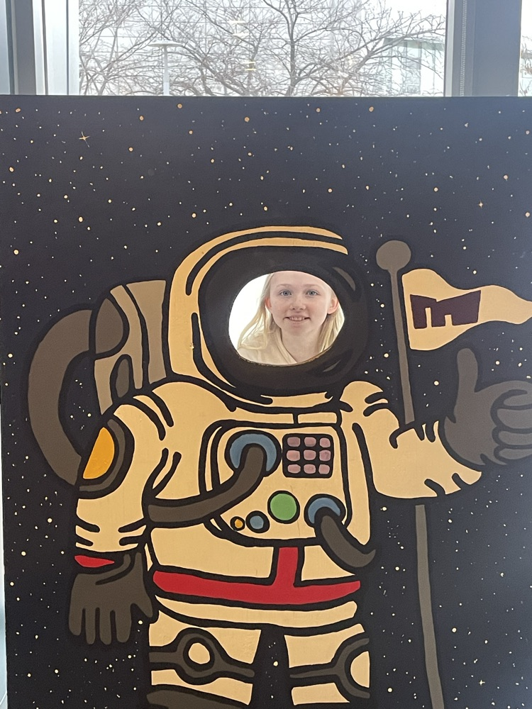 girl in an astronaut photo board
