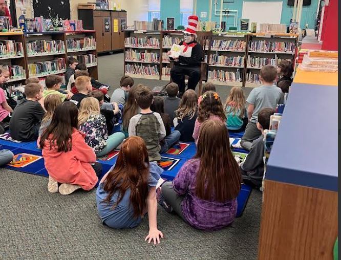 The Cat in the Hat (Mrs. Shaver) reading to students
