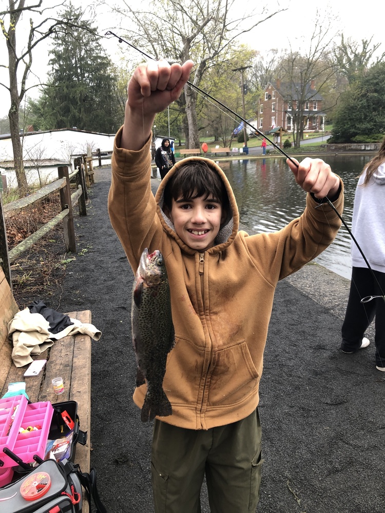 MS Student catching a rainbow trout