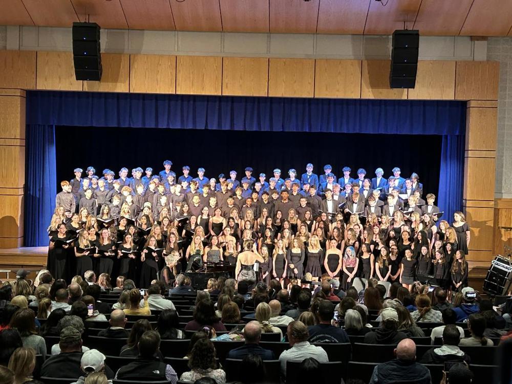 MS and HS Choir on stage in the Buck Theatre