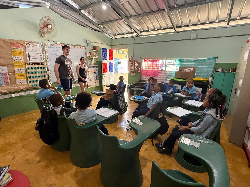 Two Students teaching younger class