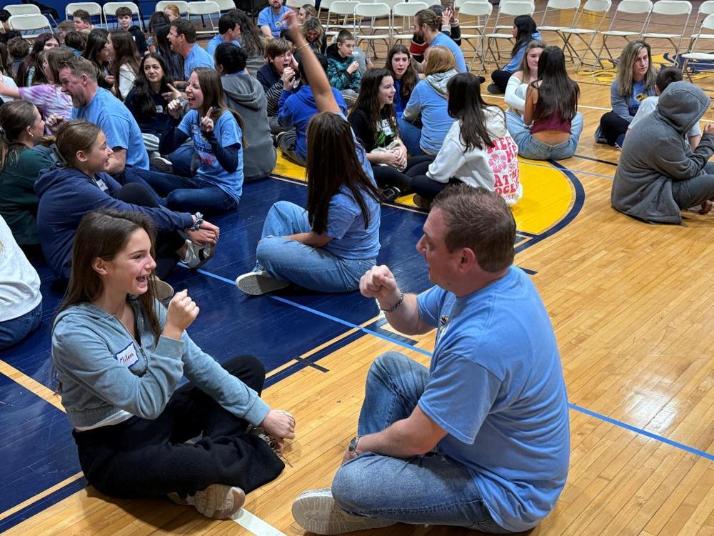 7th grader and teacher fist bumping