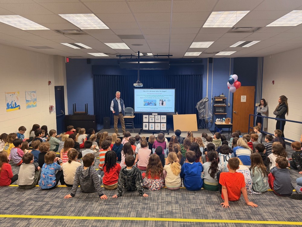 Author Tim Gilbert, presenting to a room of 2nd grade students