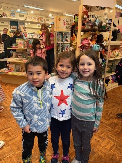 three students smiling