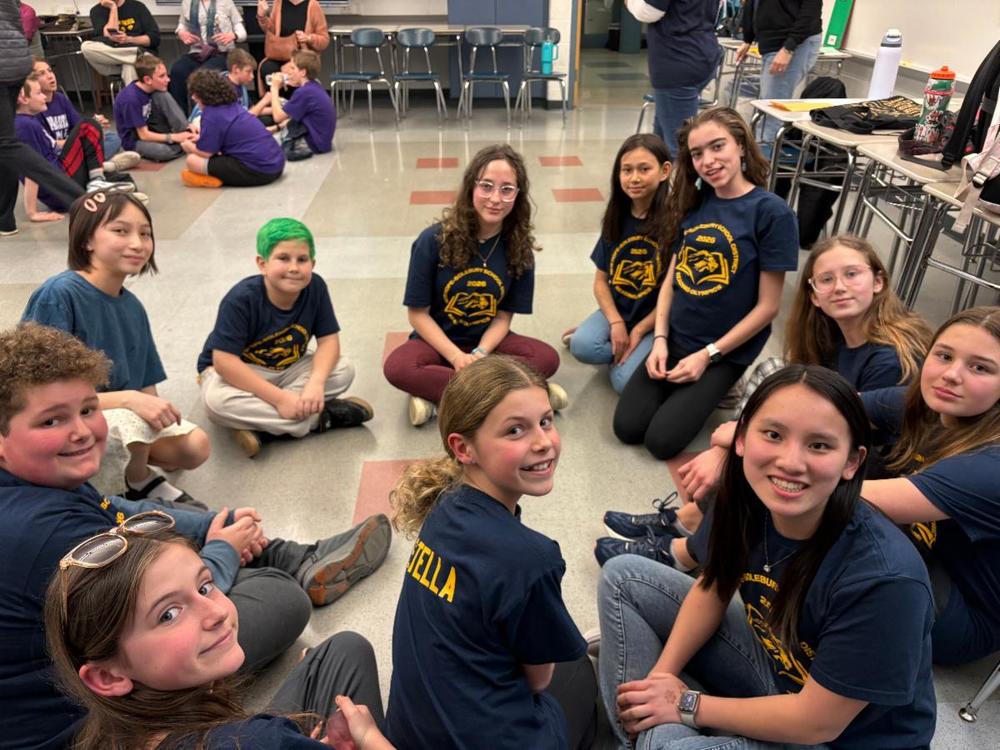 Reading Olympics Students gathered around