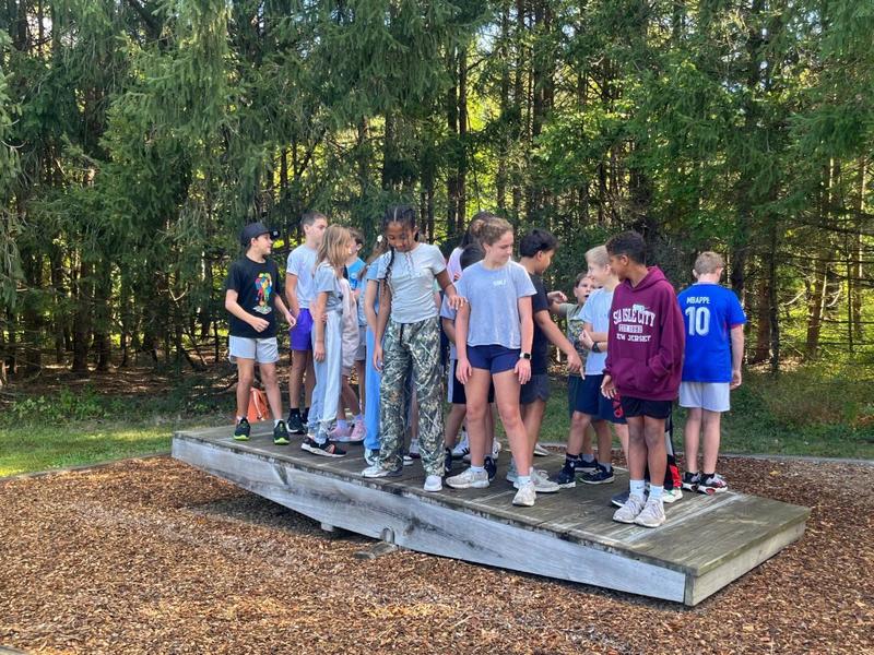 6th graders on a sea-saw at Camp America