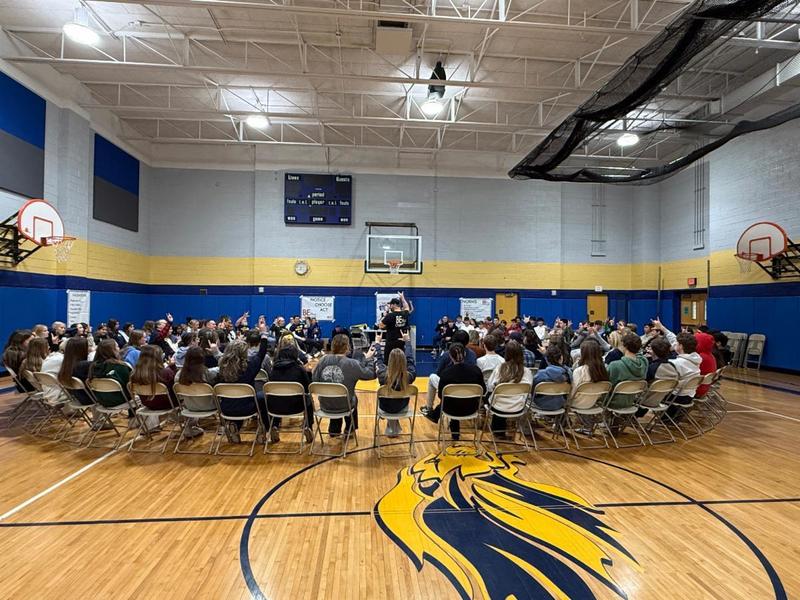 7th grade challenge day group picture in the gym
