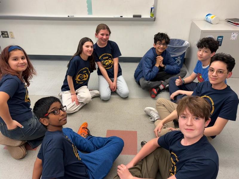 Reading Olympics Students gathered around